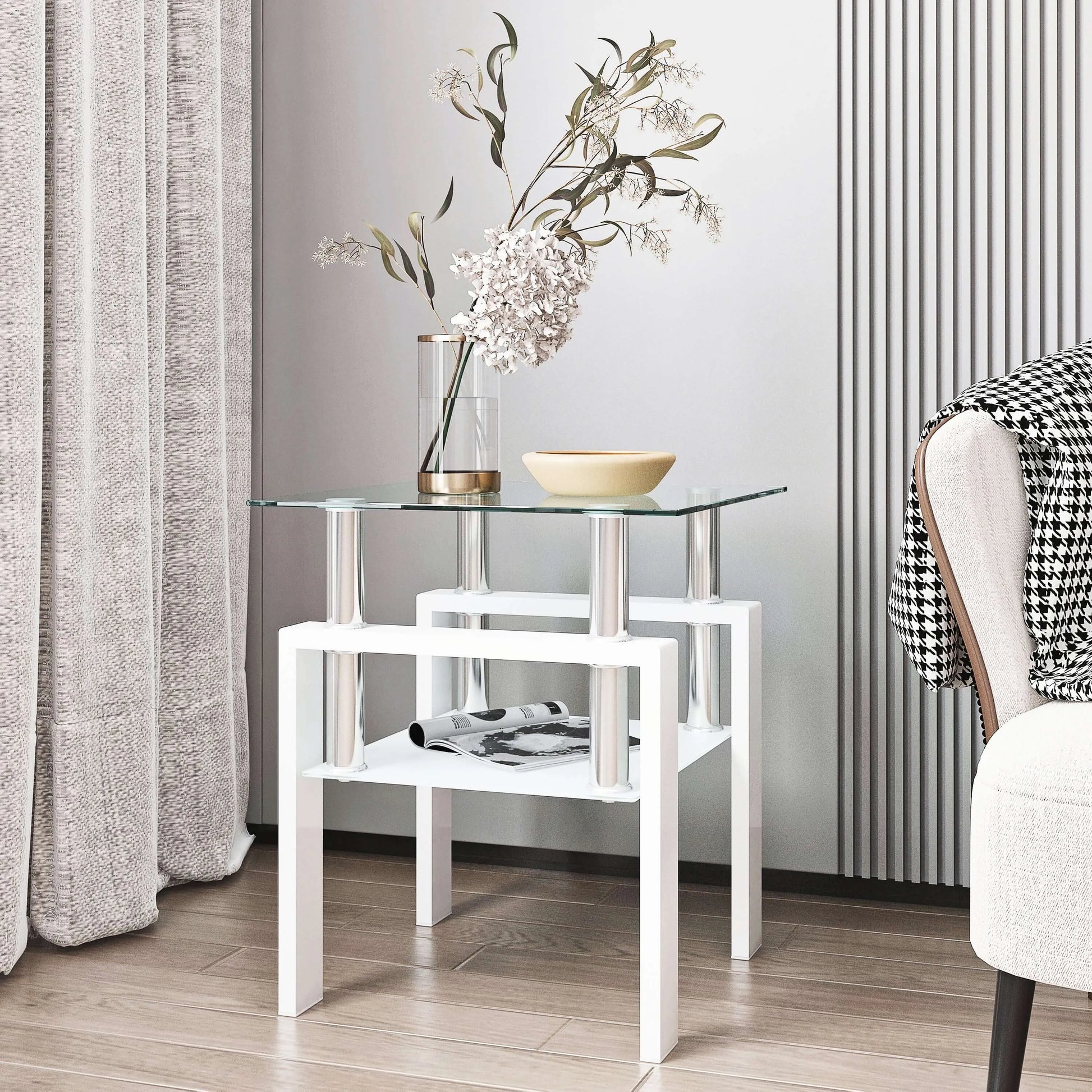 White end table with a glass top and frosted glass shelf with decorative items in a room setting.