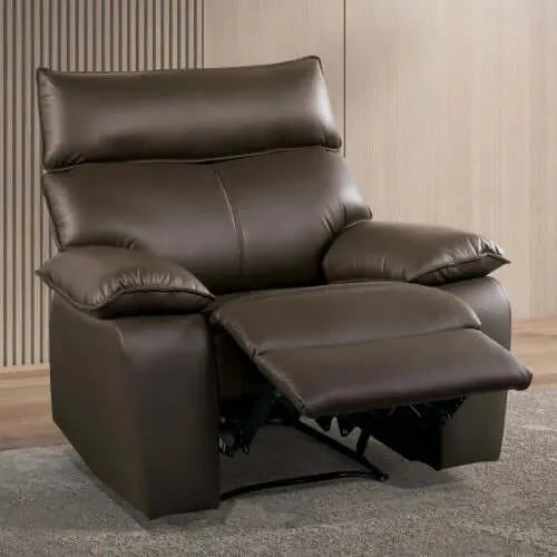 Brown faux leather recliner chair  with footrest extended in a room with wooden flooring and a neutral wall.