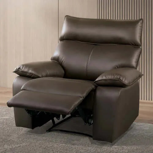 Brown faux leather recliner chair in a room with wooden flooring and striped wallpaper.