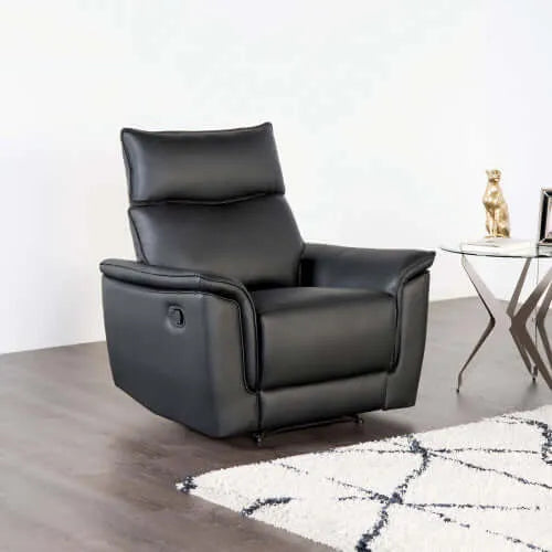 Black leather recliner chair in a modern living room setting.