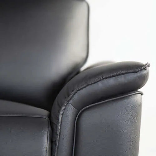 Close-up of a black leather recliner chair pillow arm top on a white background