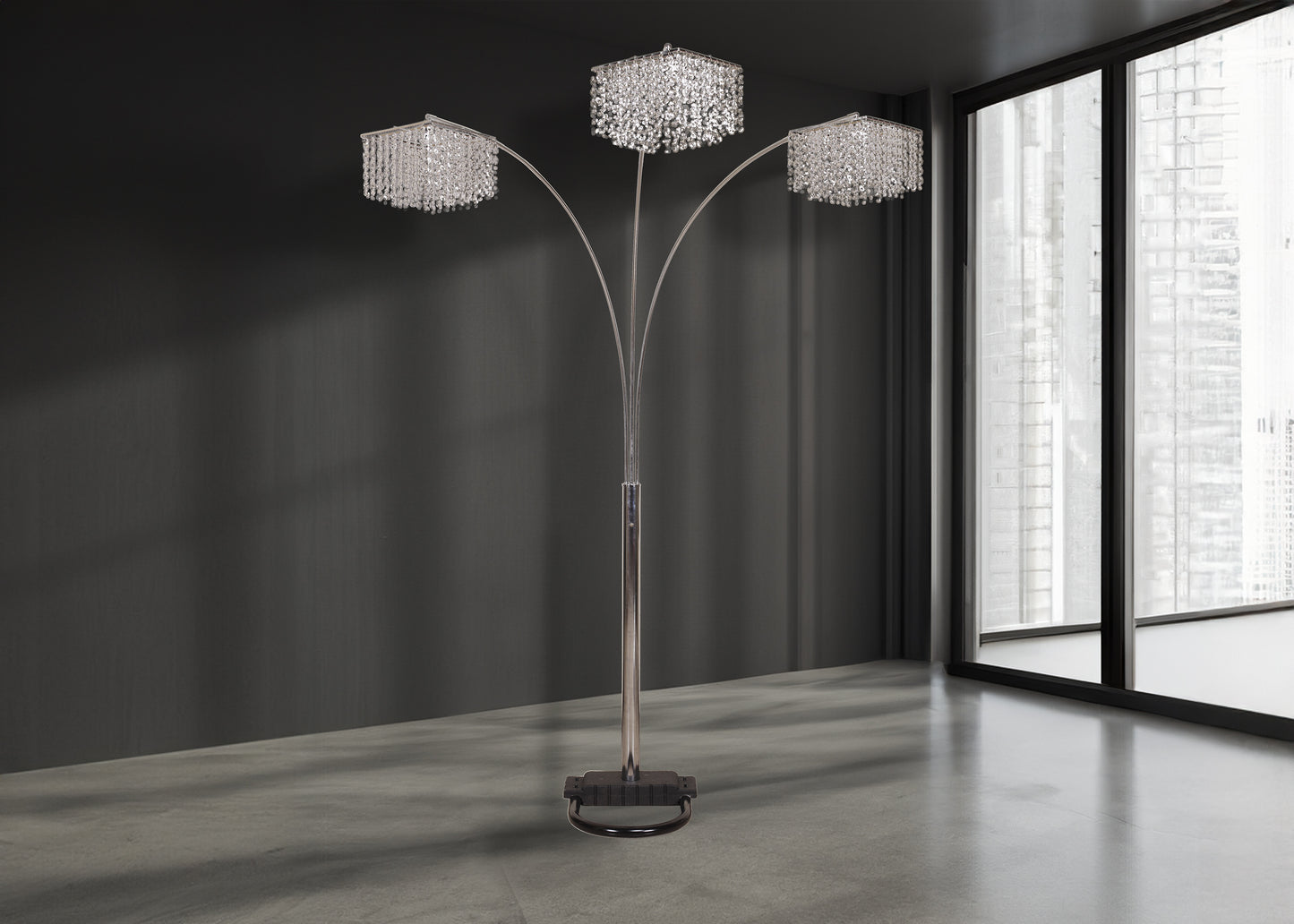 Modern floor lamp with three crystal shades in a room with large windows.