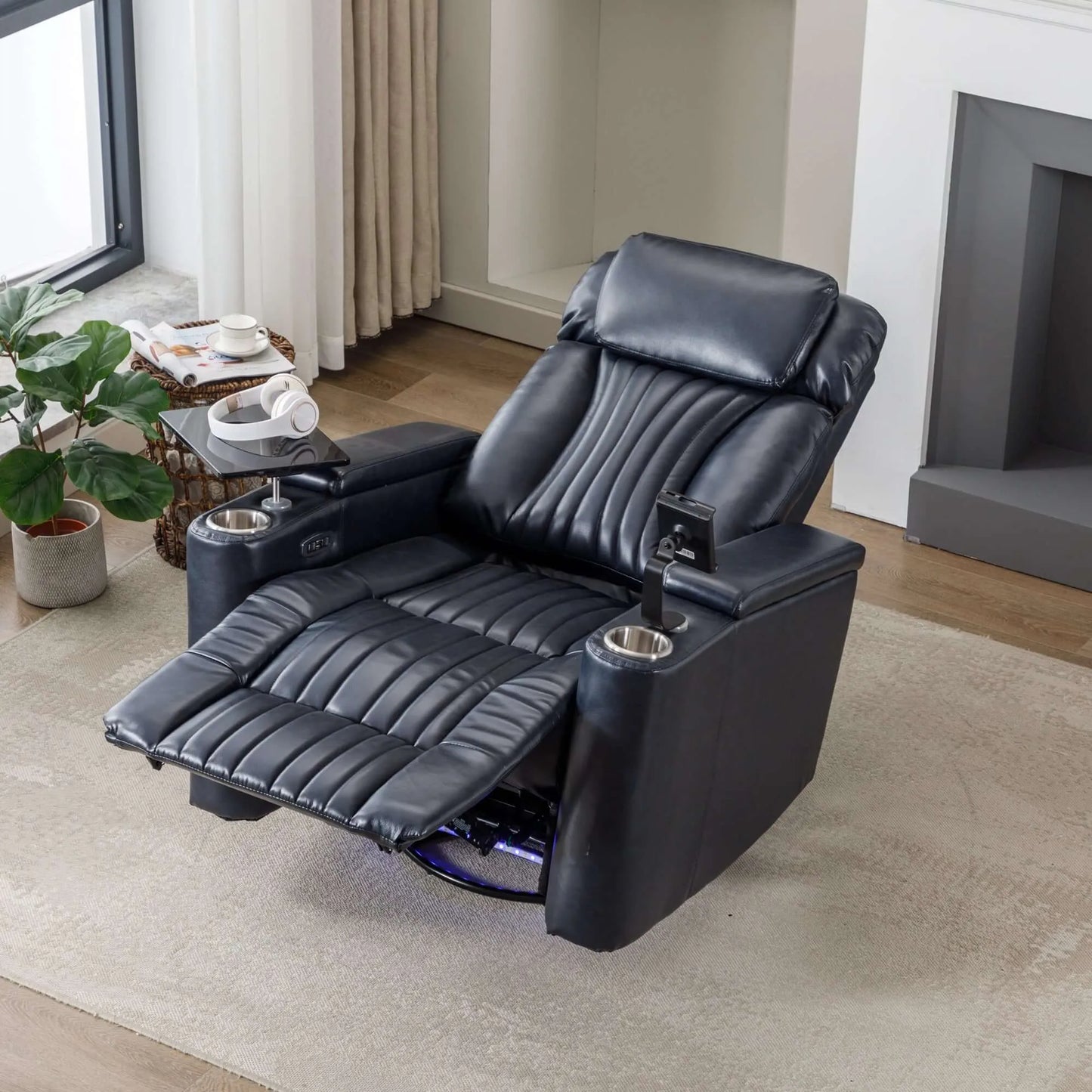 Top view of a blue leather recliner chair fully reclined in a living room setting with a fireplace and window.