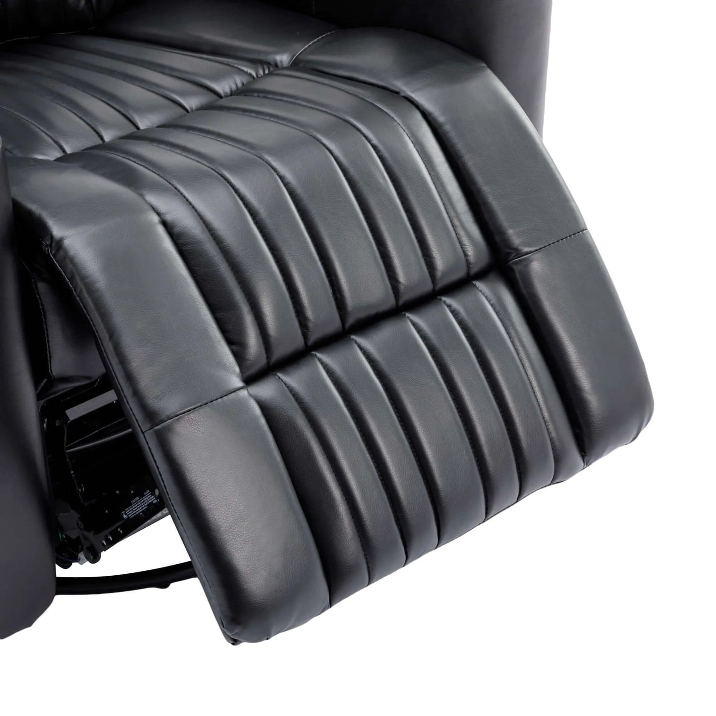 Close-up of a black leather recliner chair extended footrest on a white background