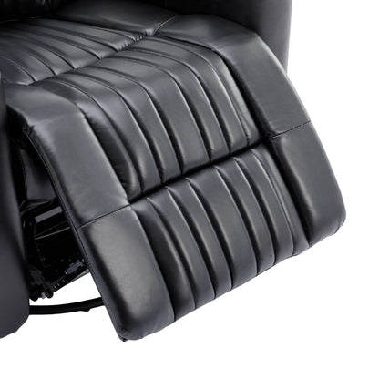 Close-up of a black leather recliner chair extended footrest on a white background