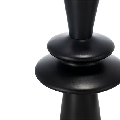 Close-up of a black lamp base on a white background