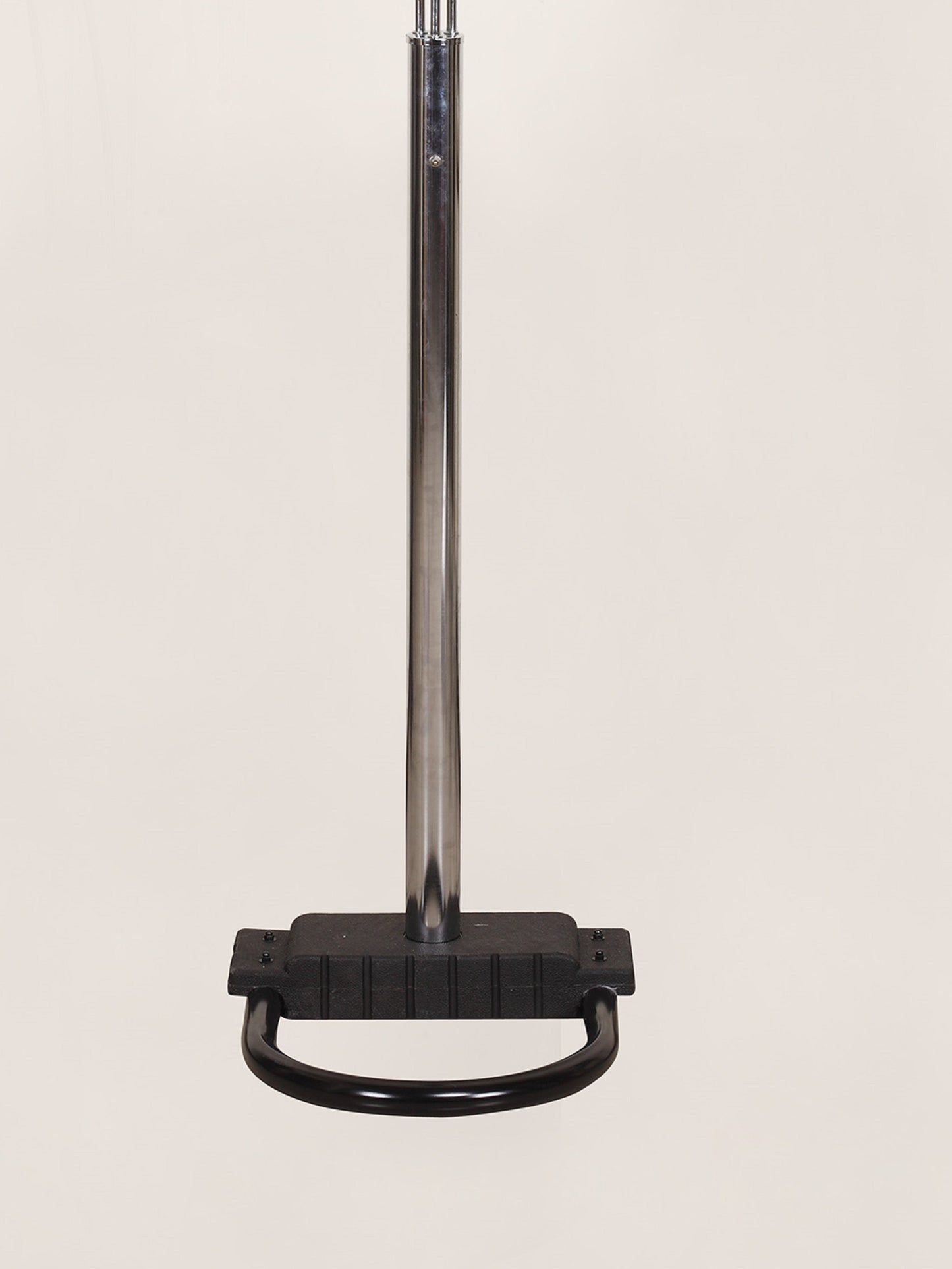 Black metal floor lamp base on a beige background