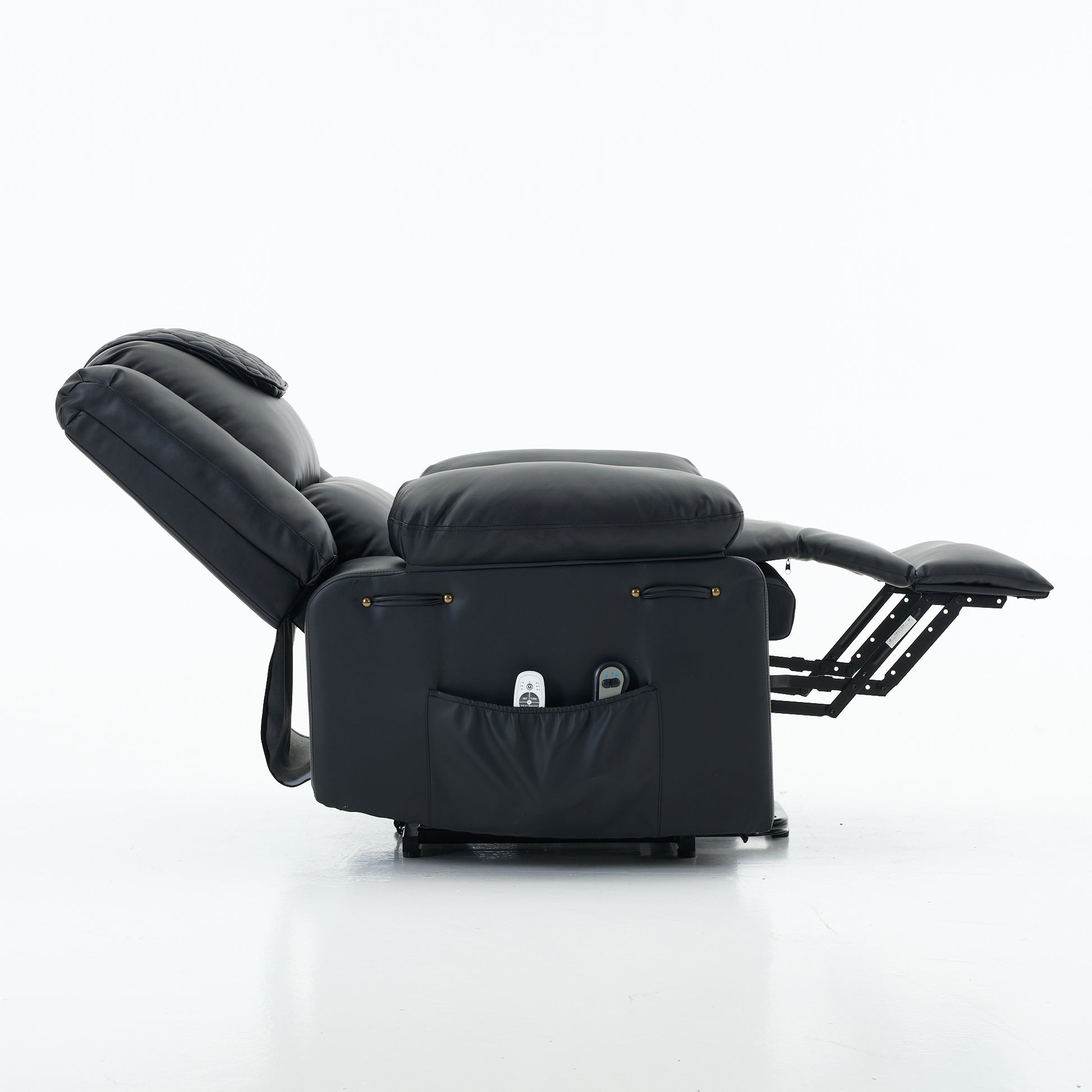 Black recliner chair fully relclined with a storage pocket and decoractive detail on a white background