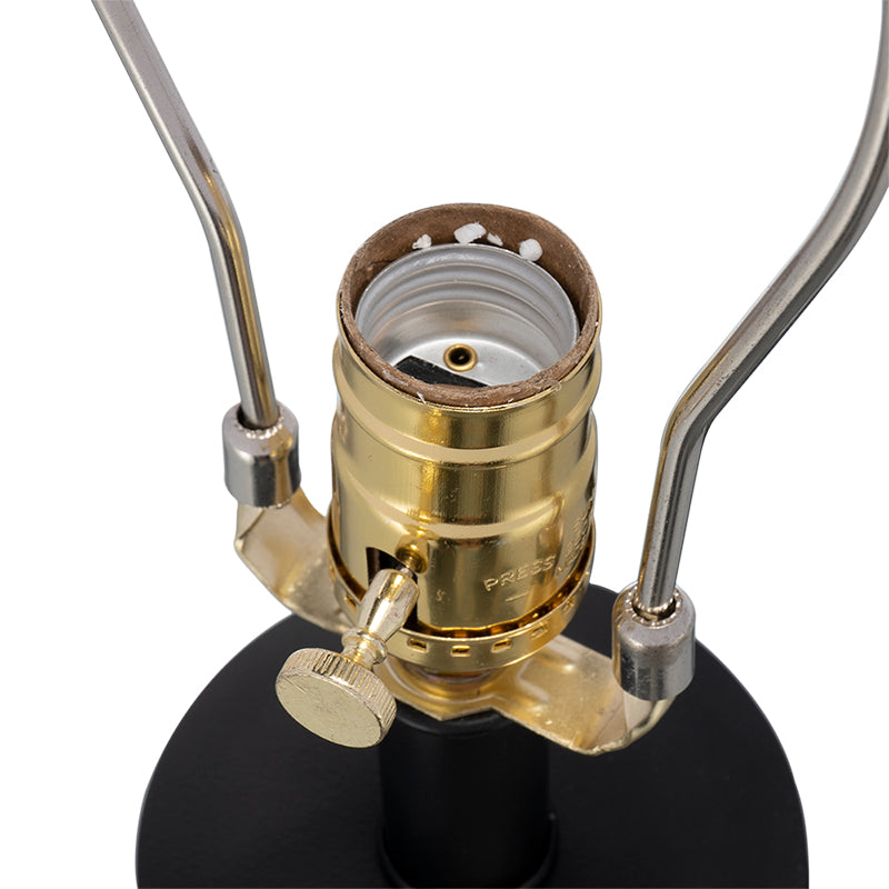 Close-up of a lamp socket with brass fitting on a white background