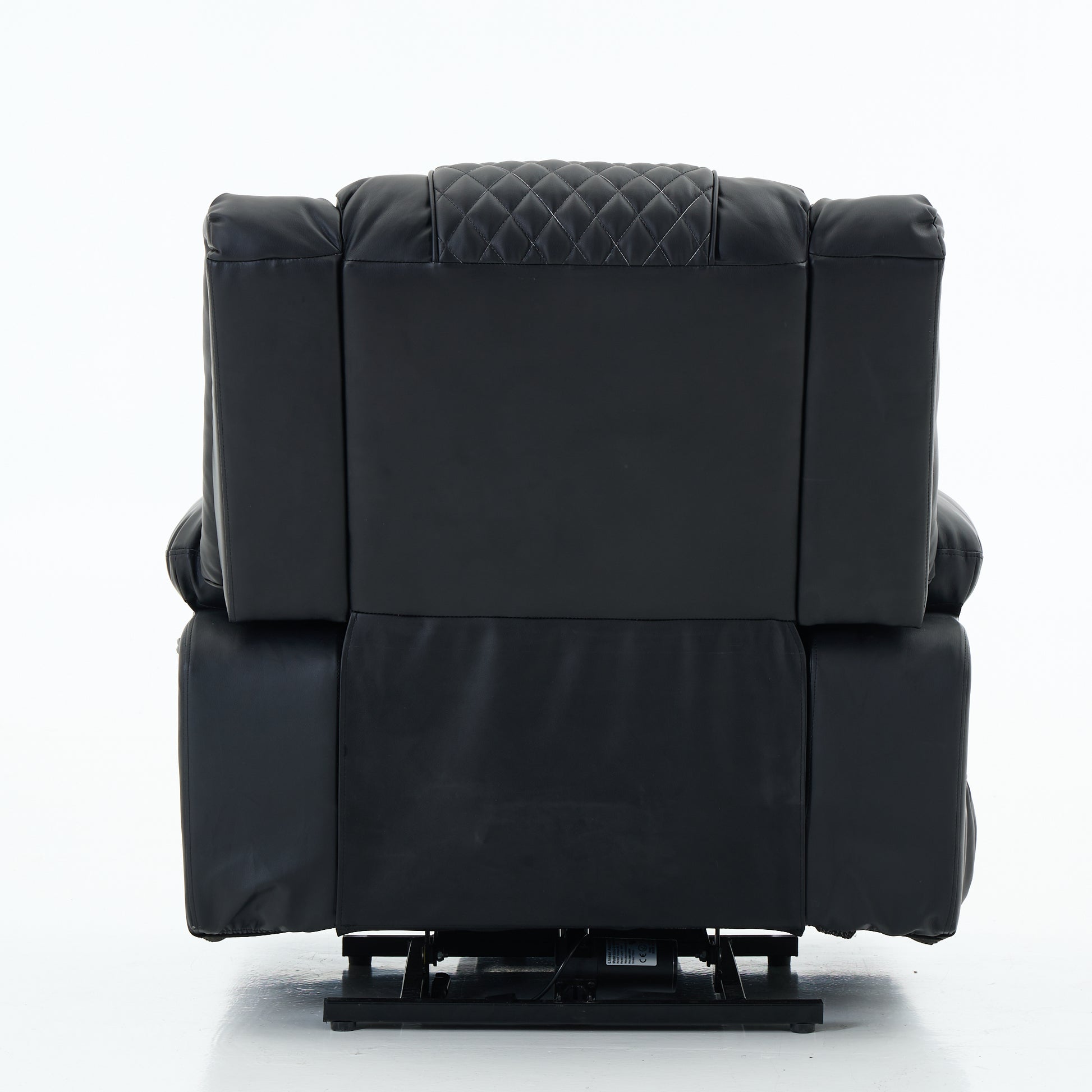 Back side view of a black recliner chair with quilted backrest on a white background
