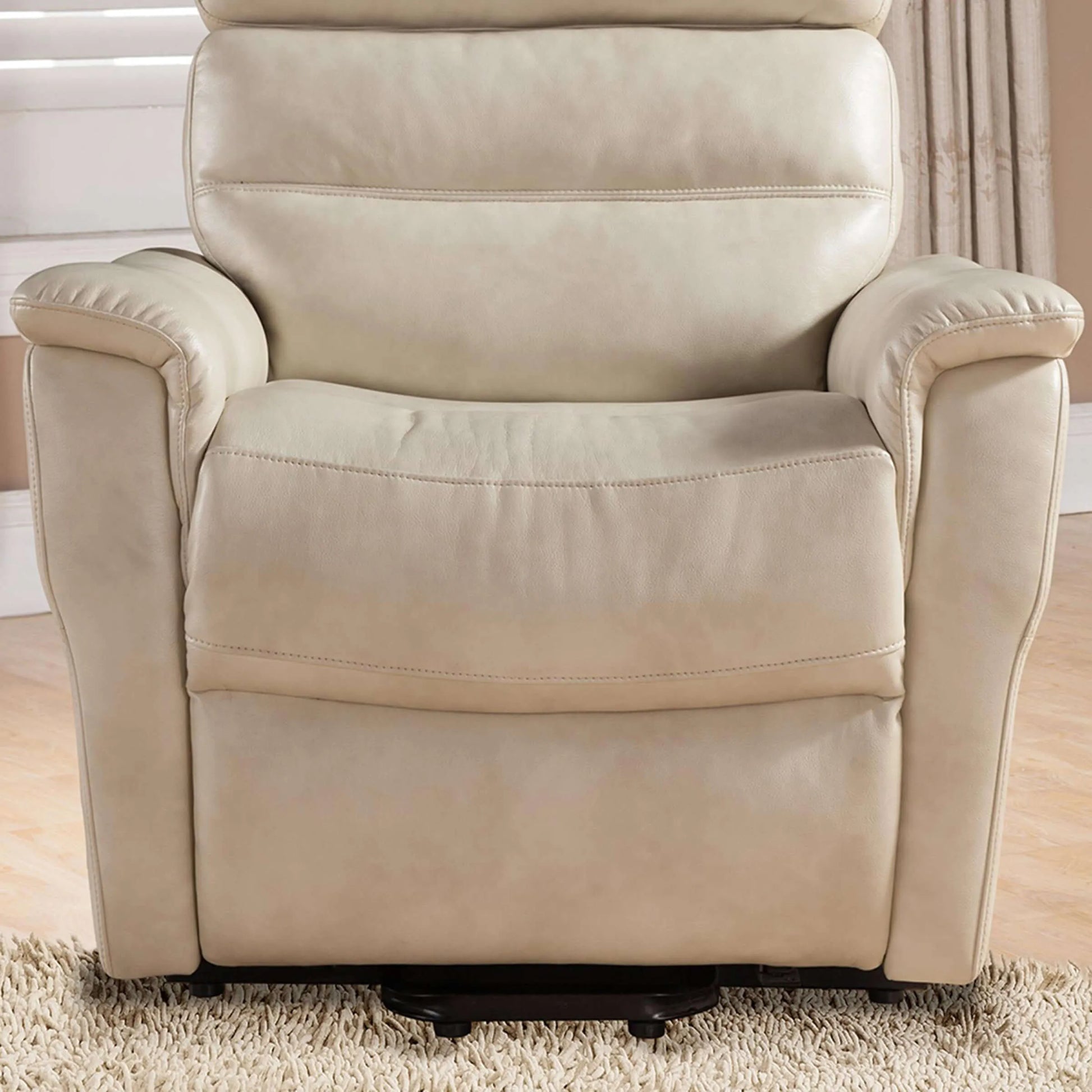 Cream color recliner chair in a living room setting