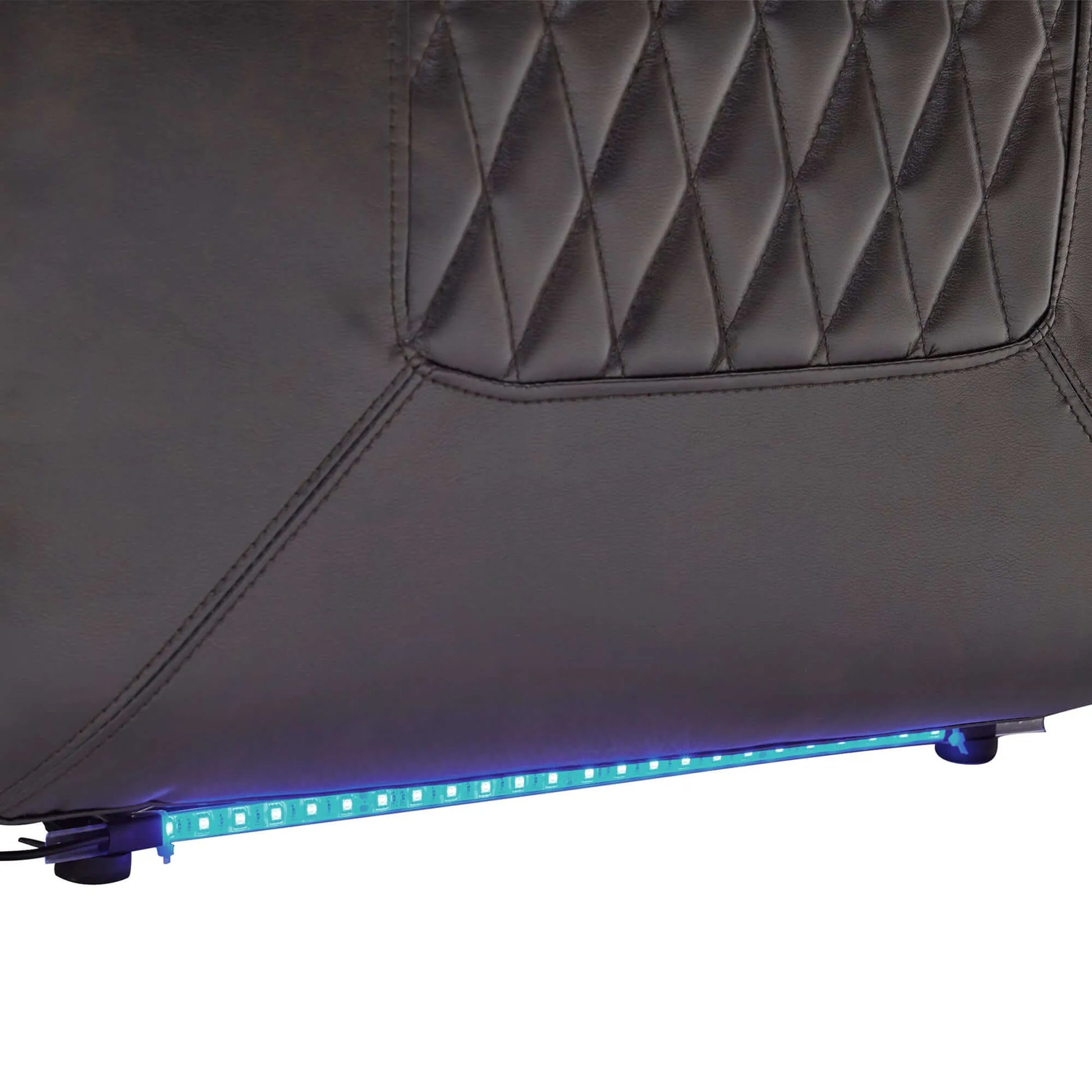 Close up of a blue LED strip at the bottom of a black faux leather power motion recliner chair on a white background