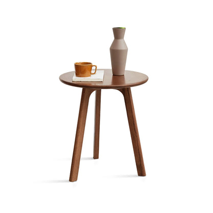 Wooden end table with a vase and cup on a white background