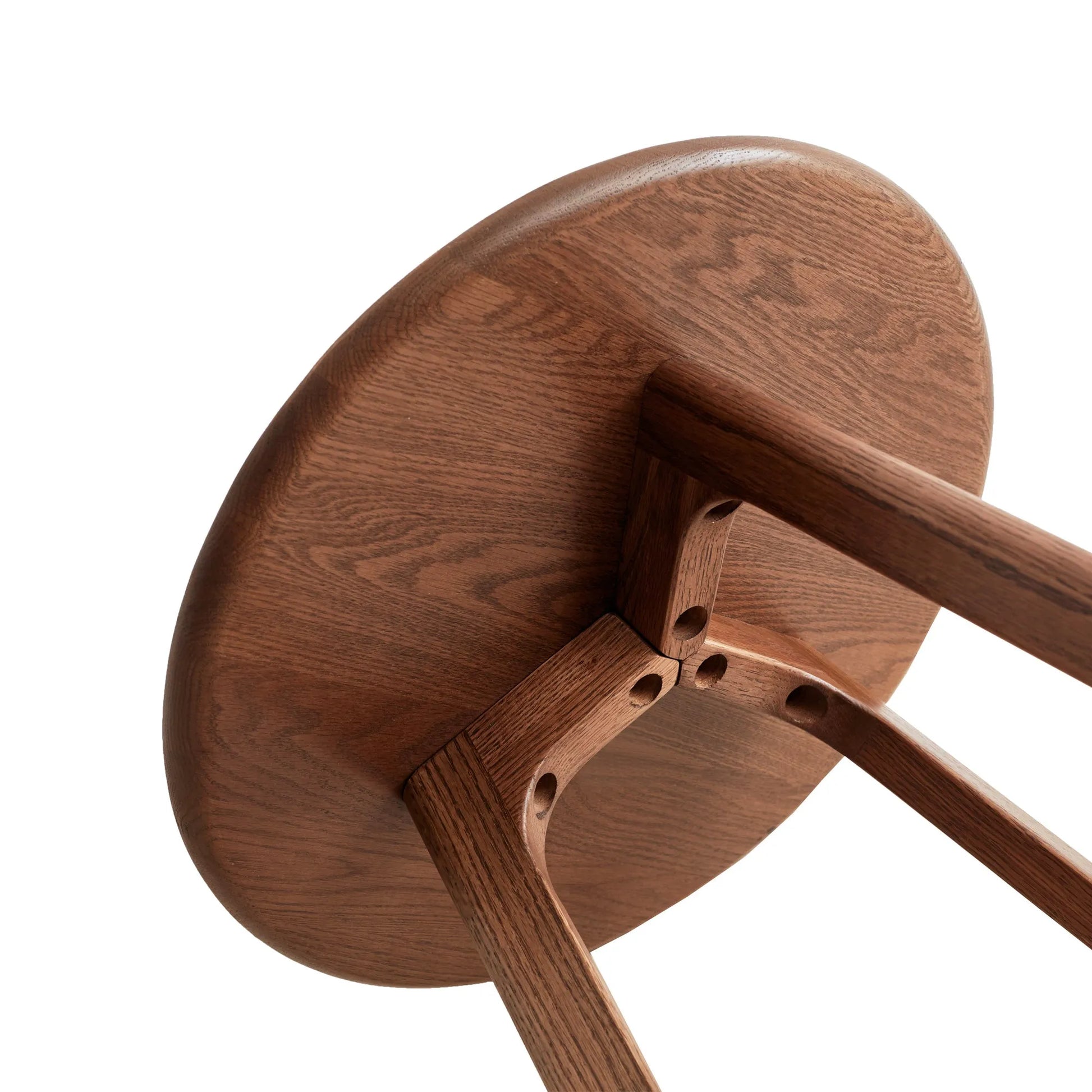 Close-up of a wooden end table with a white background