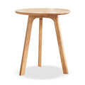 Wooden side table with three legs on a white background