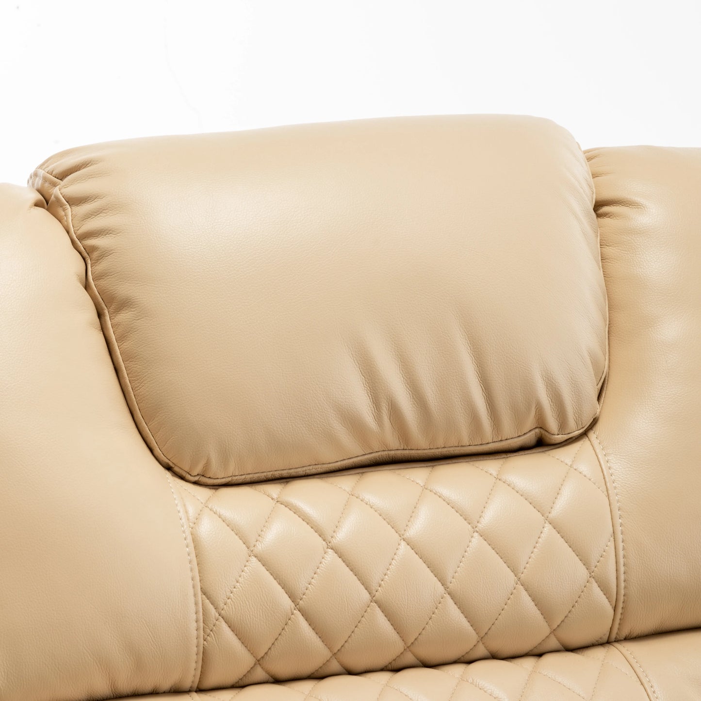 Close up of a beige quilted recliner chair with a pillow top cushion on a white background