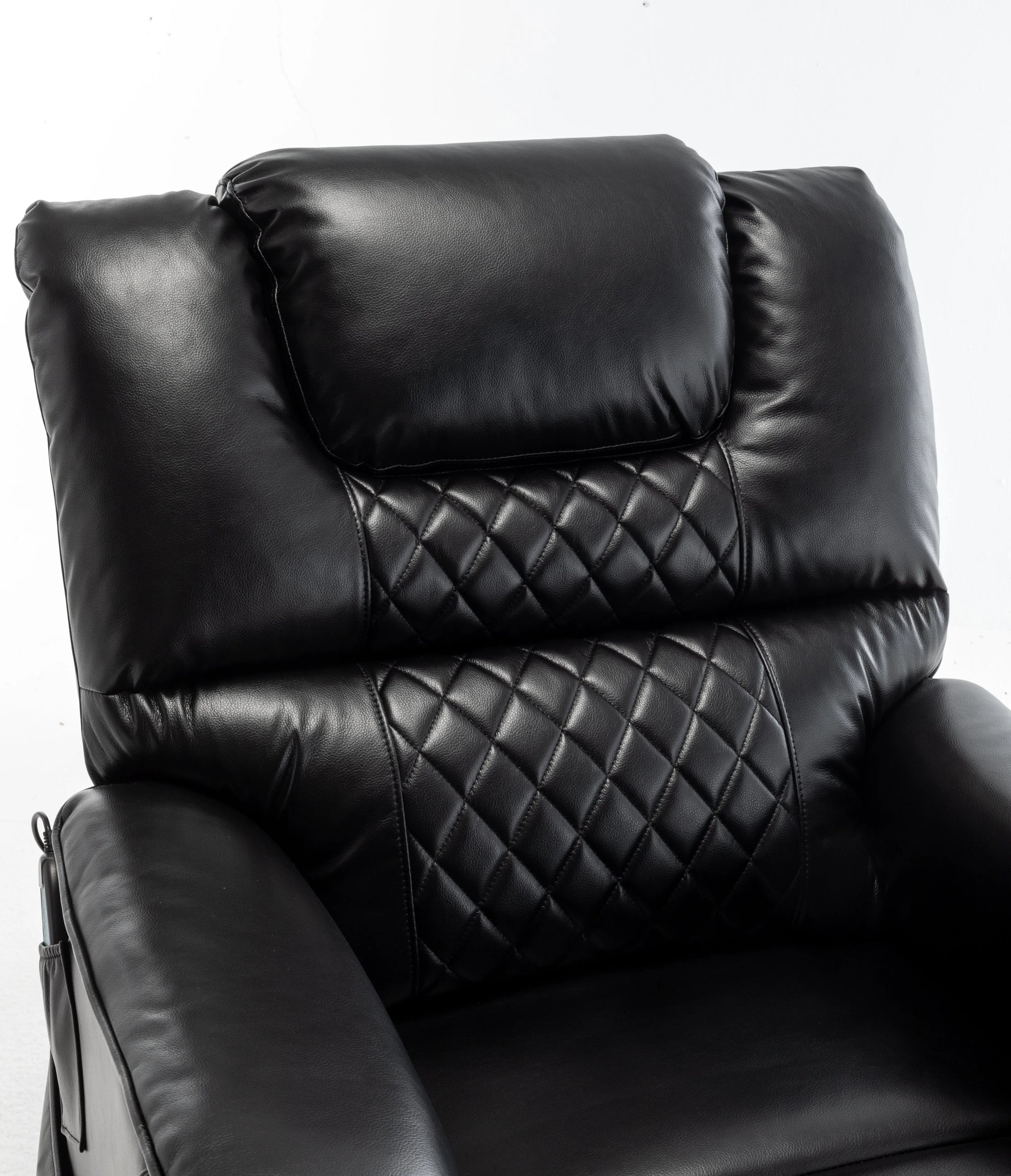 Black leather recliner chair with quilted pattern on a white background