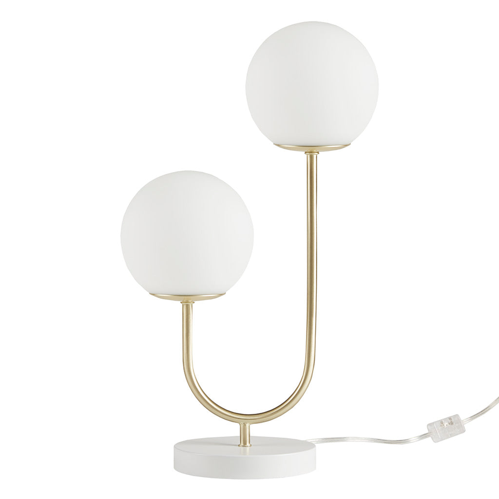 Table lamp with two white spherical lights on a gold base and white marble foot, on a white background.