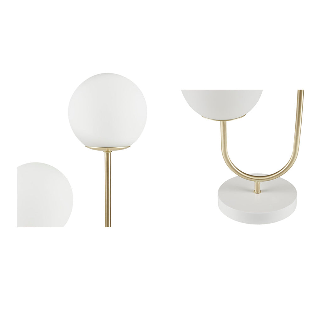 Set of two table lamps with white glass shades and marble bases on a white background