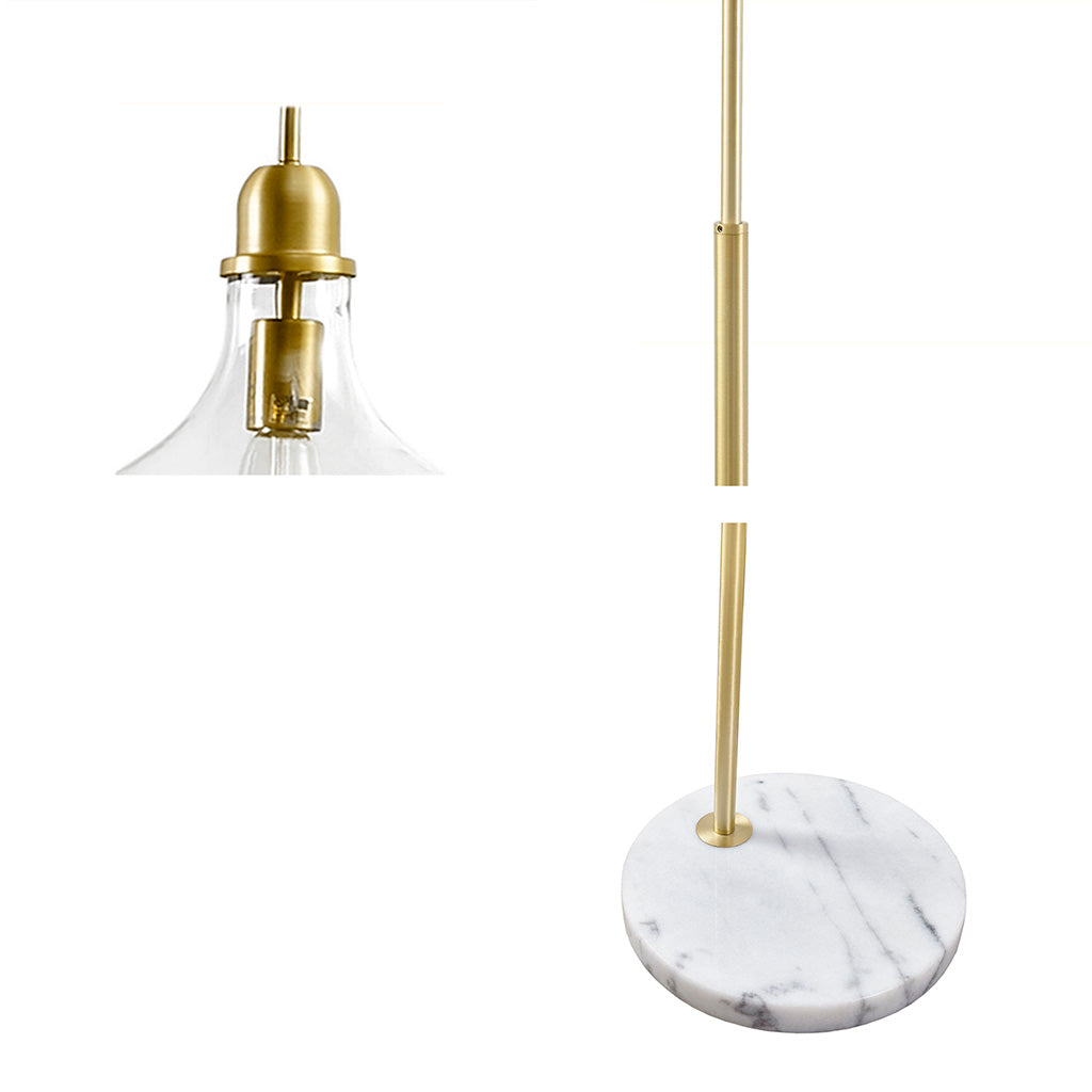 Floor light with gold fixture and marble base on a white background