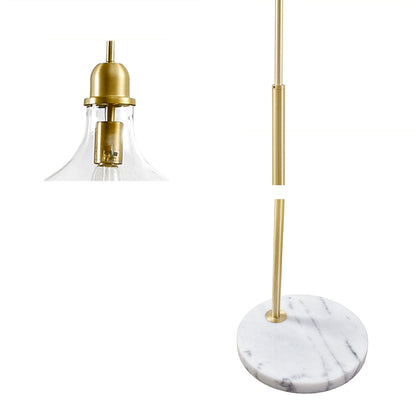Floor light with gold fixture and marble base on a white background