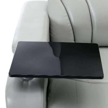 Close up of a black tray on a gray faux leather recliner chair.
