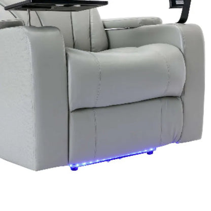 The footrest of a gray faux leather recliner chair with LED lighting on a white background