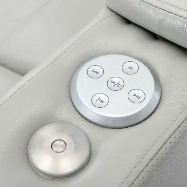 Control panel with buttons on a gray faux leather reclining chair
