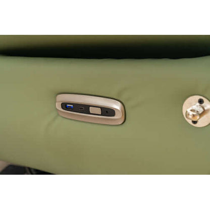 Green leather recliner chair with USB charging port and lock on a white background