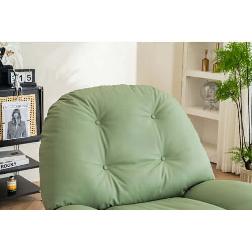 Green leather recliner chair in a room with decor elements.