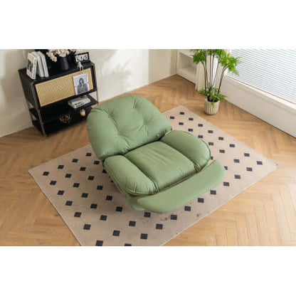 Green leather reclining chair on a patterned rug in a room with wooden flooring and a window.