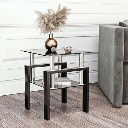 Modern end table with glass top and shelf with black metal legs in a living room setting.
