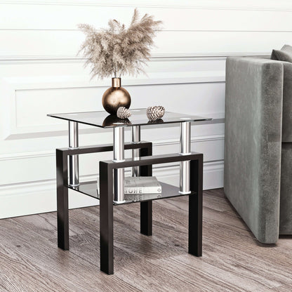 Modern end table with glass top and black metal legs in a living room setting.