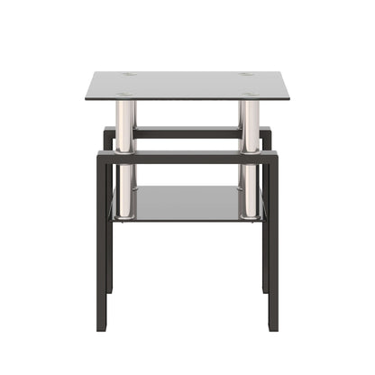 Small end table with a black glass top and lower shelf with black metal frame on a white background