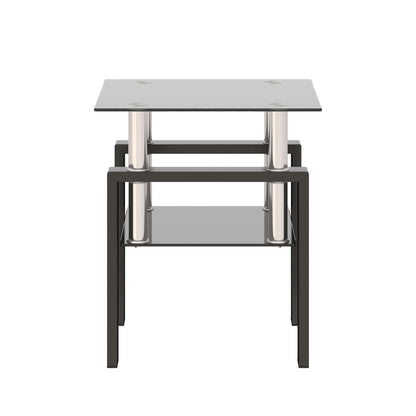 Small end table with a black glass top and lower shelf with black metal frame on a white background