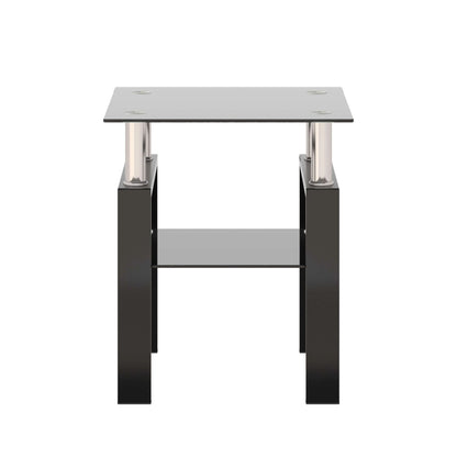 Small end table with a black glass top and lower black glass shelf with black metal legs on a white background