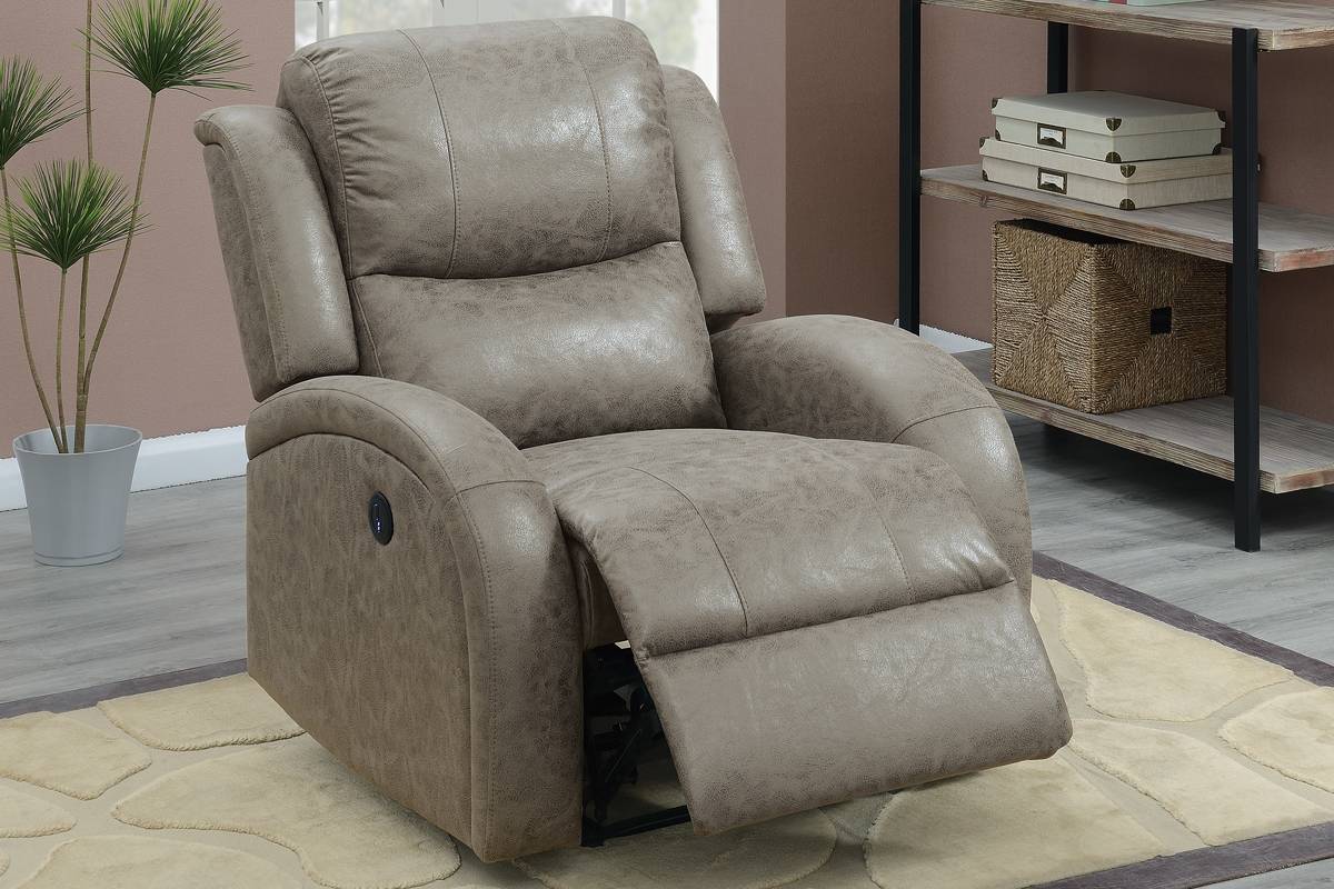 Gray leather recliner chair in a room with a plant and shelves.