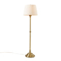 Floor lamp with a white drum shade on a white background