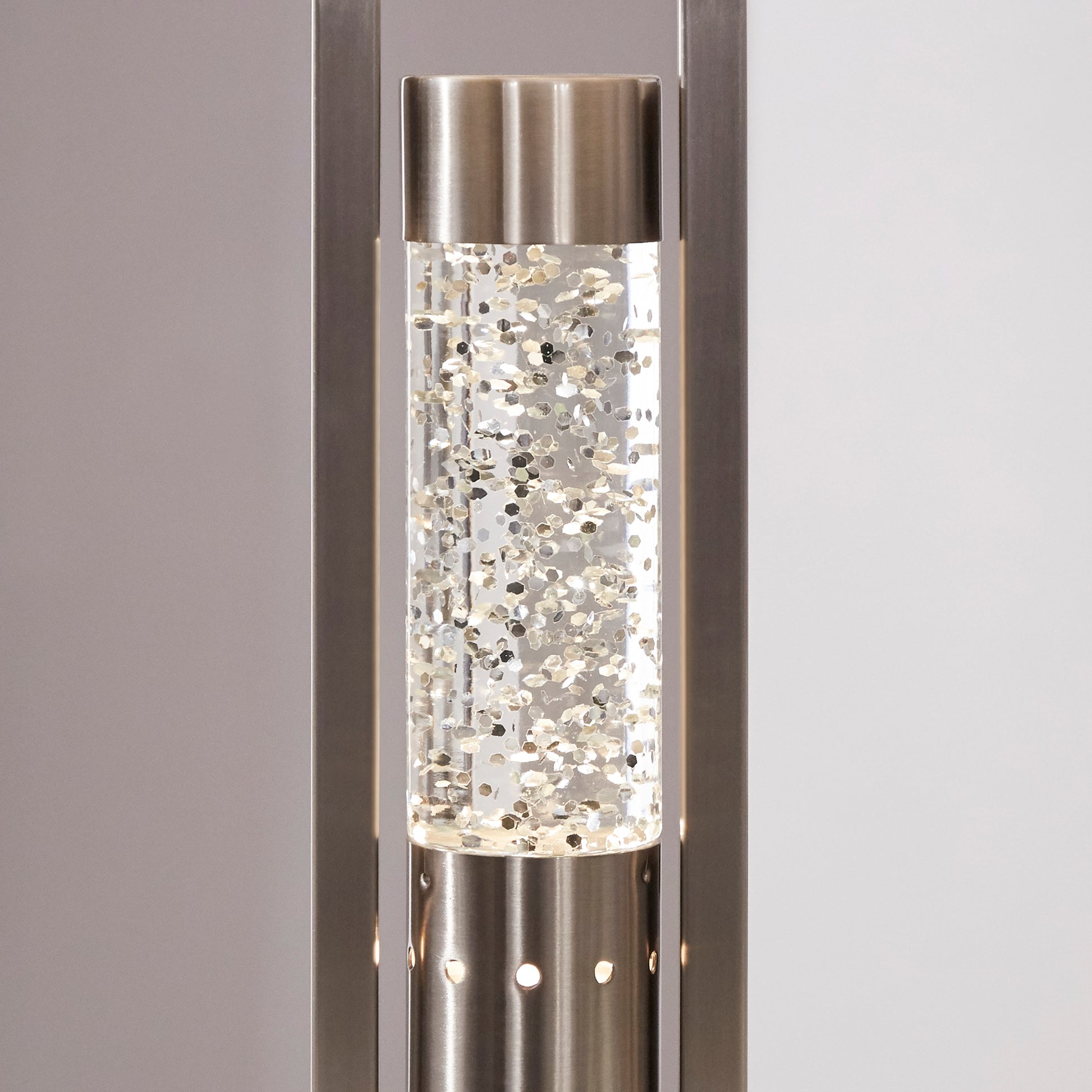 Decorative lamp base with crystal accents on a neutral background