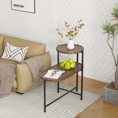 Living room with beige sofa, 2-tier wooden and metal end table, and decorative elements.