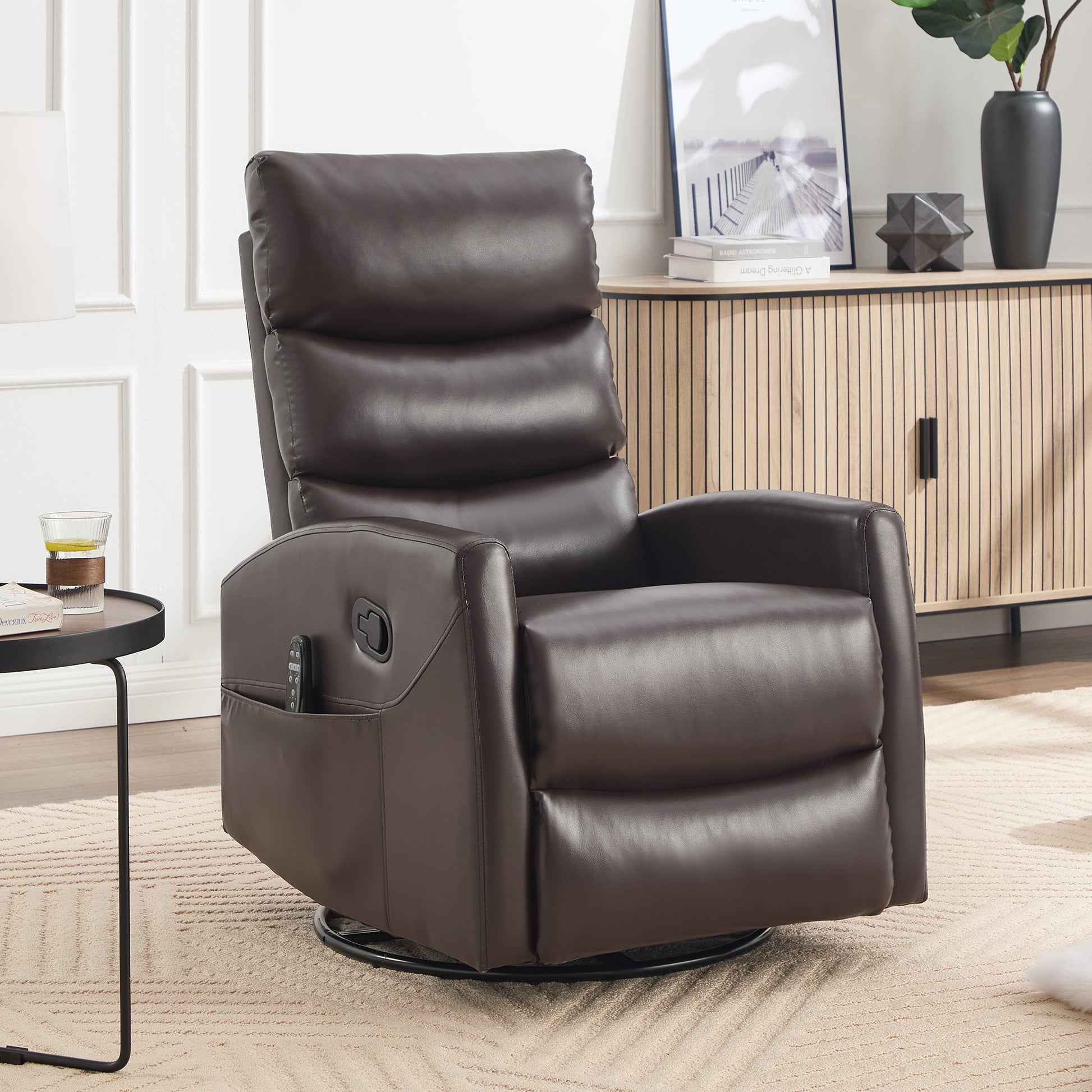Brown leather recliner chair in a living room setting with a side table and decorative items.