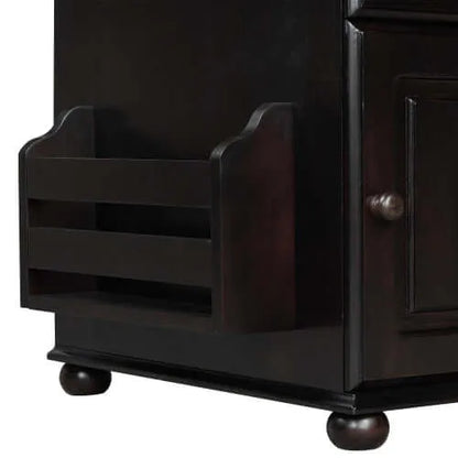 Dark brown wooden end table with book holder and round legs on a white background