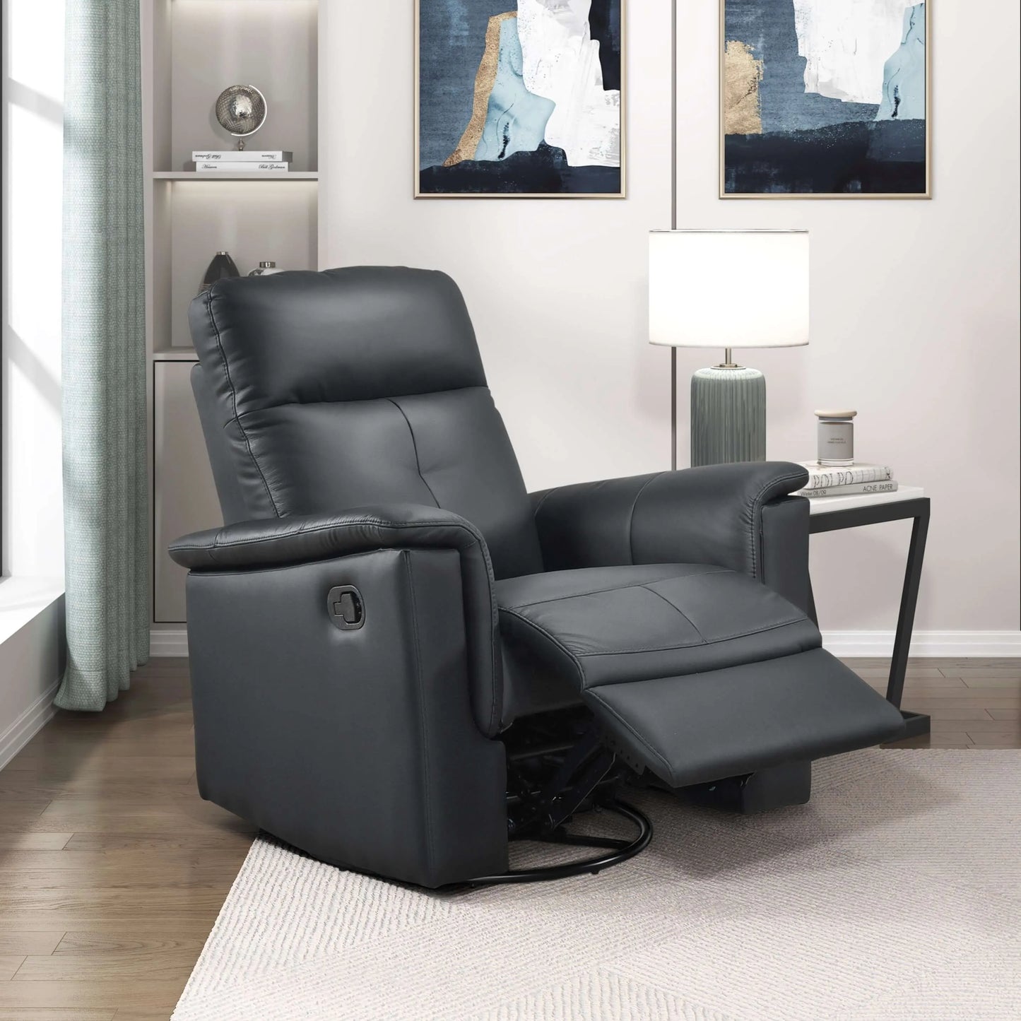 Black leather recliner chair in a living room setting with abstract art on the wall.