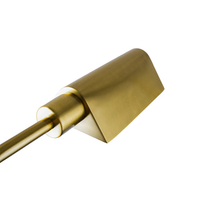 Close up of a brass lamp shade on a white background