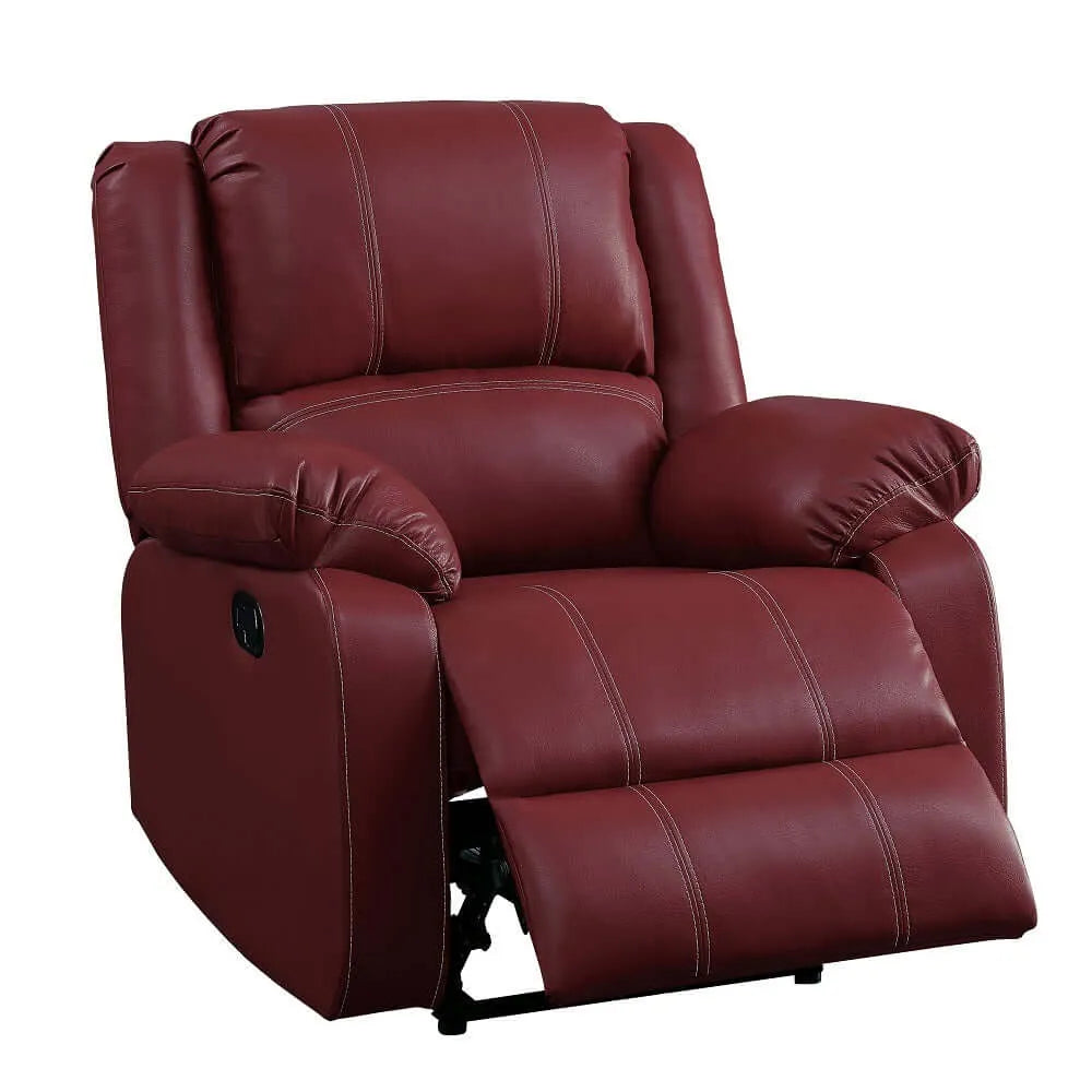 Red leather recliner chair  with footrest partially extended on a white background