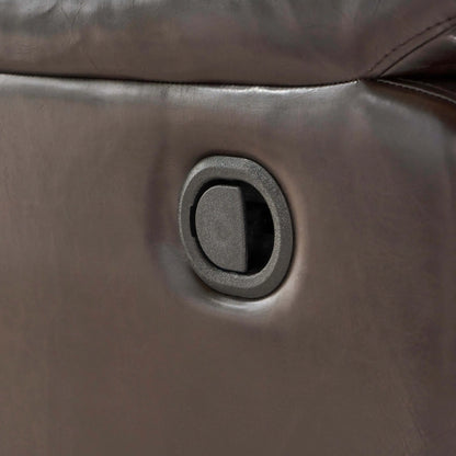 Close-up of a brown leather reclining chair button.