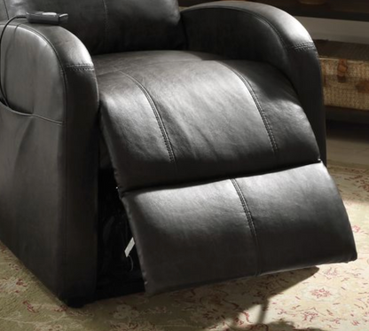 Close up of a dark brown faux leather recliner chair footrest slightly extended on a patterned rug