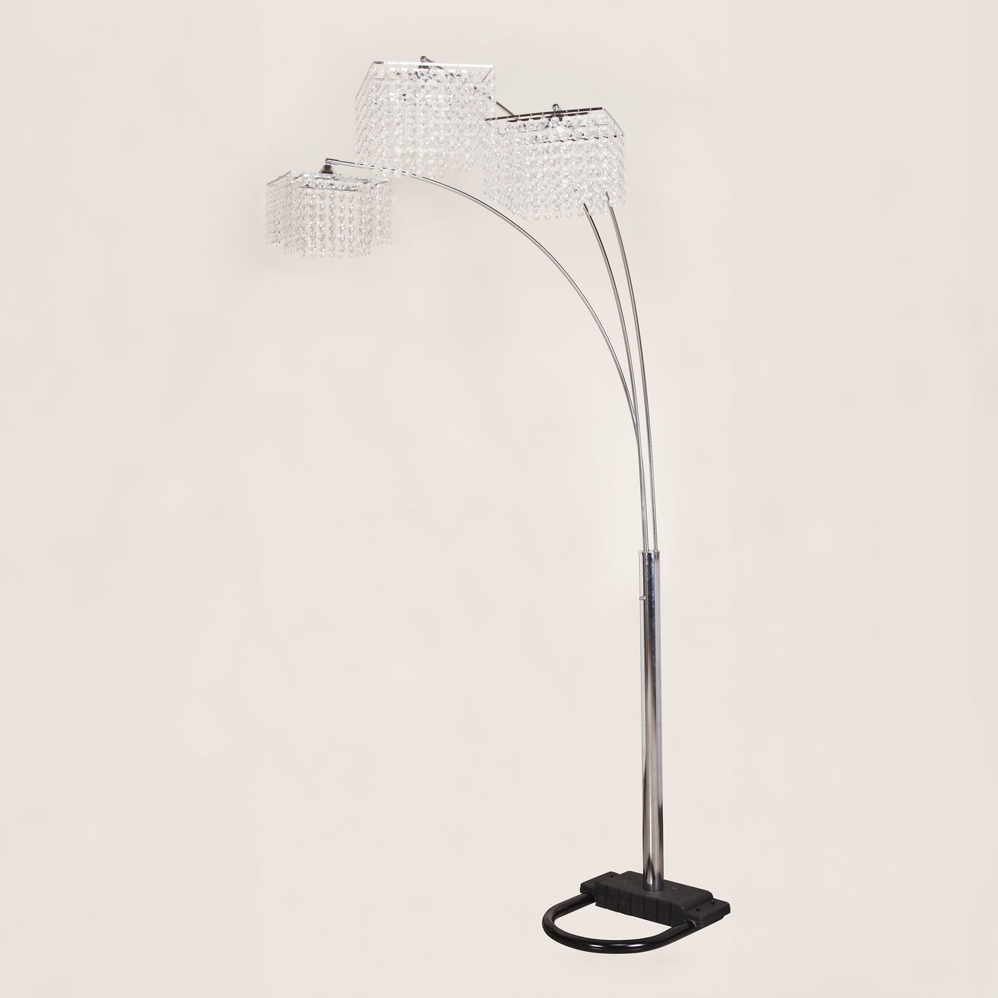 Arc floor lamp with crystal-like shades on a light gray background