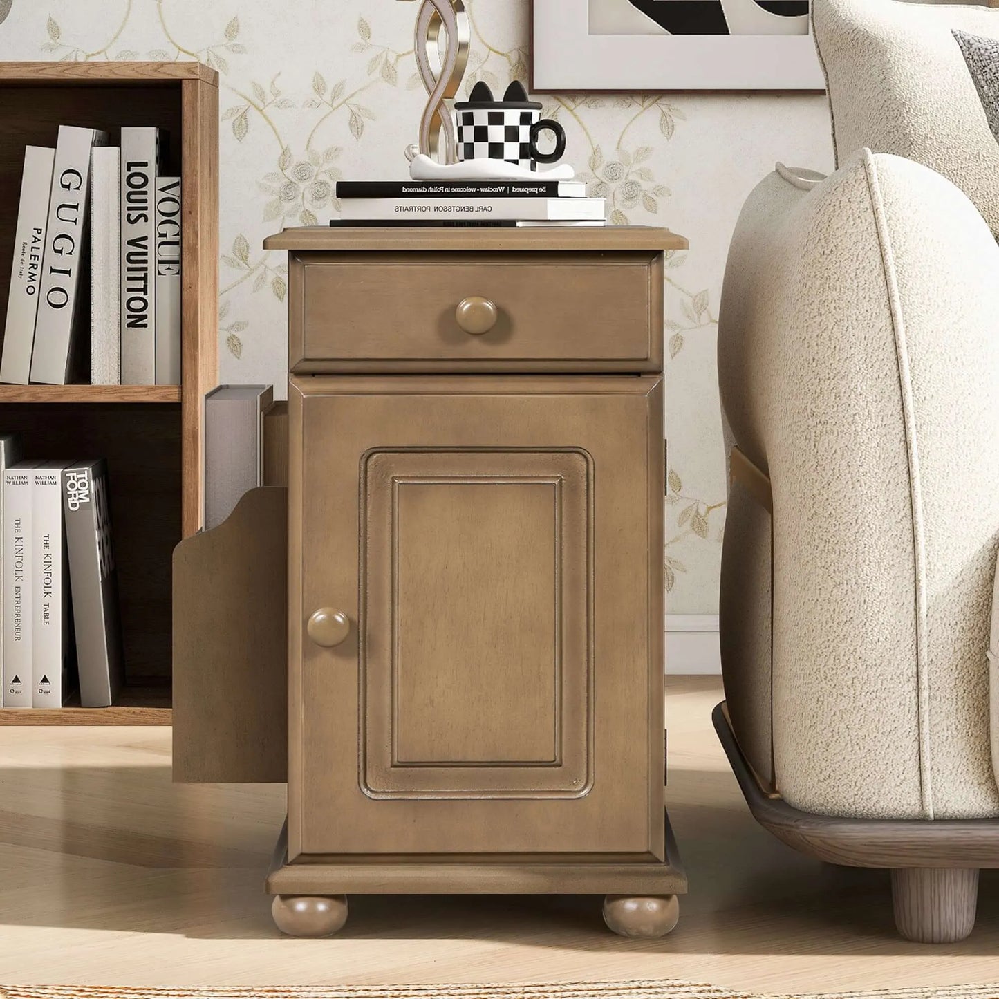 Wooden end table with a drawer and cabinet door in a home setting.