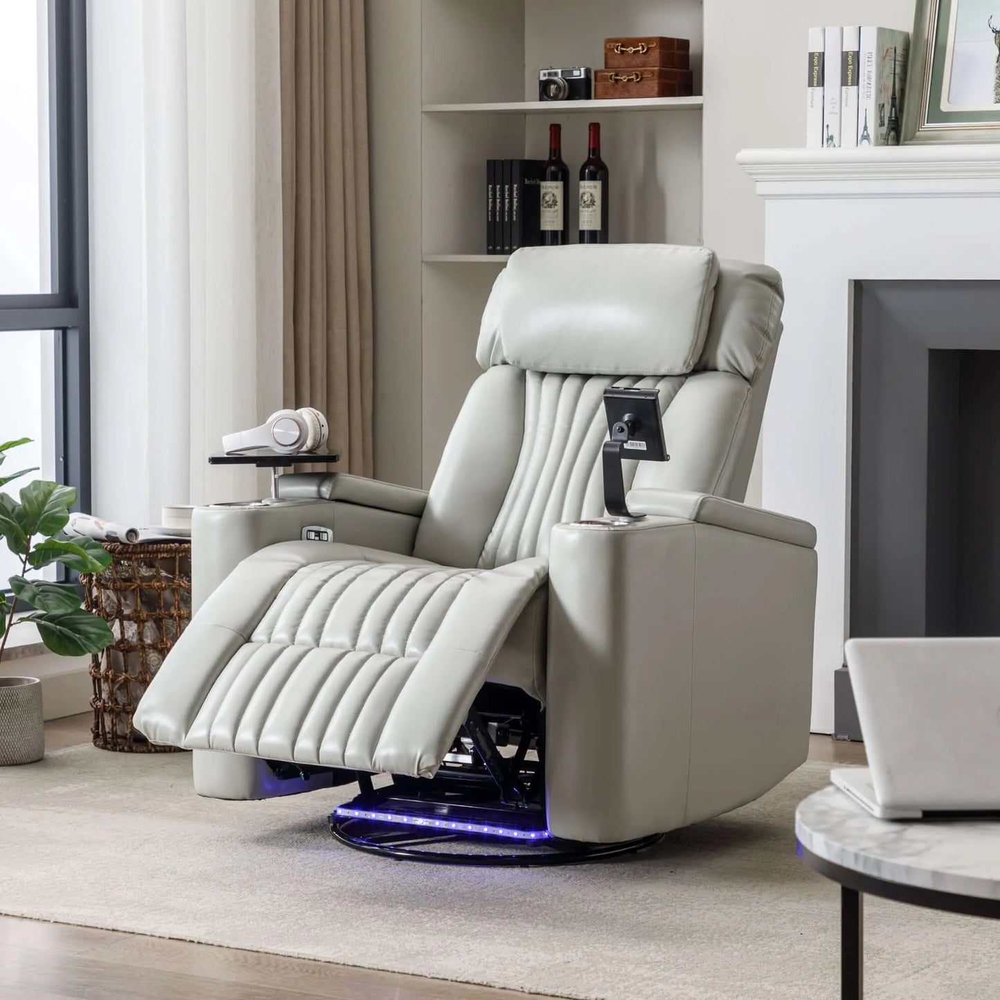Gray recliner chair in a living room setting with a fireplace and shelves in the background.
